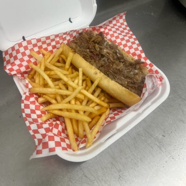 Philly Cheesesteak Provo or Cheese Sauce Sandwich On Armoroso Roll With Fries.