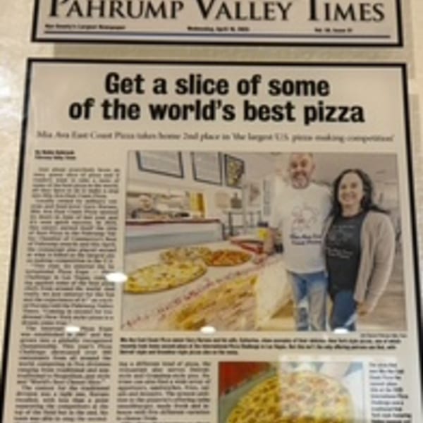 Newspaper article about Mia Ava East Coast Pizza, featuring owners and pizzas.