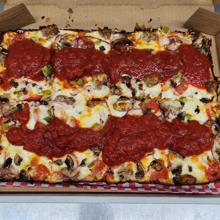 Indulge in Our Supreme Pizza